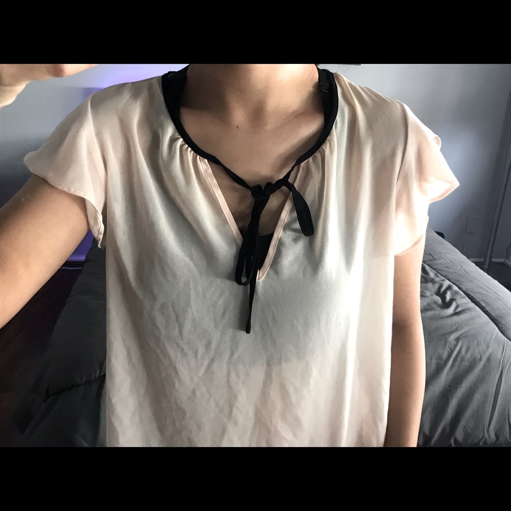 Light pink blouse with black string tie